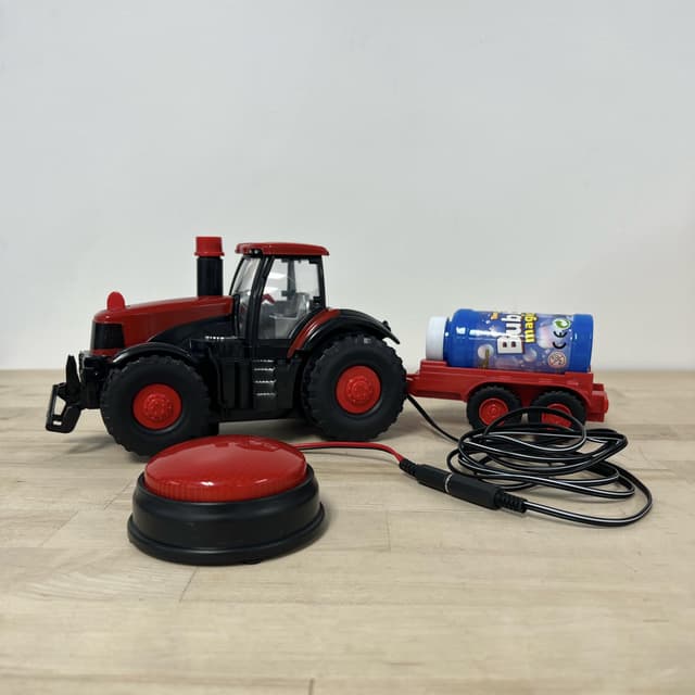 Red and black farmer truck with bubble carrier