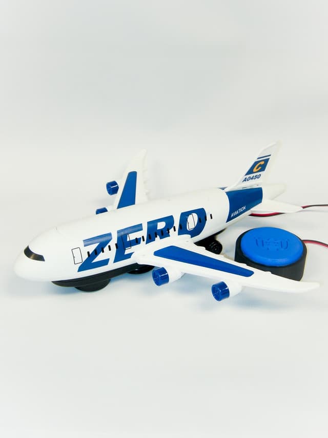 White airplane that lights up, makes noise, and lifts