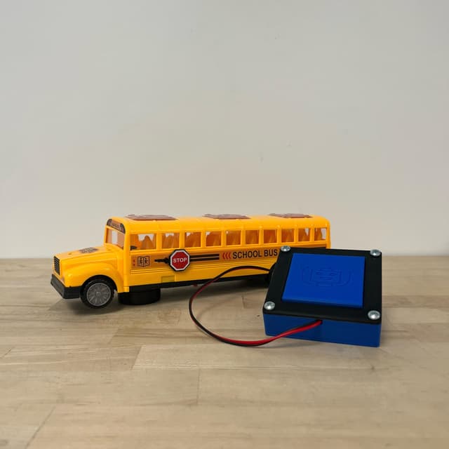 Yellow school bus that lights up, makes noise, and rolls